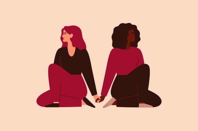 11 conselhos de terapeutas sobre aceitação e identidade Ilustração de duas mulheres sentadas no chão, uma de costas para a outra, mas com as mãos dadas