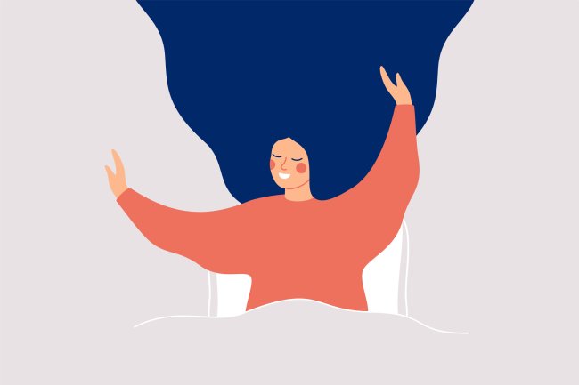 11 conselhos de terapeutas sobre aceitação e identidade Ilustração de uma mulher feliz, sorrindo e com os braços pra cima, ao acabar de acordar, mas ainda na cama