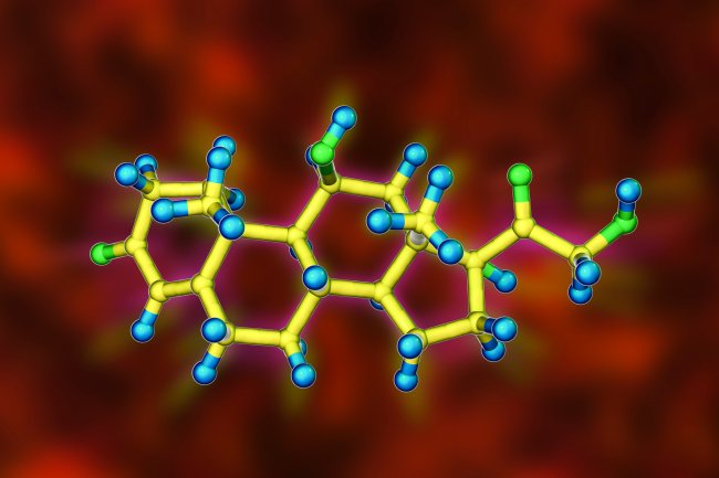 O que o estresse causado pelo término do namoro faz com nosso corpo Molde uma uma molécula de cortisol feito no computador. O fundo é vermelho, e a molécula é amarela com pontinhos em verde e azul