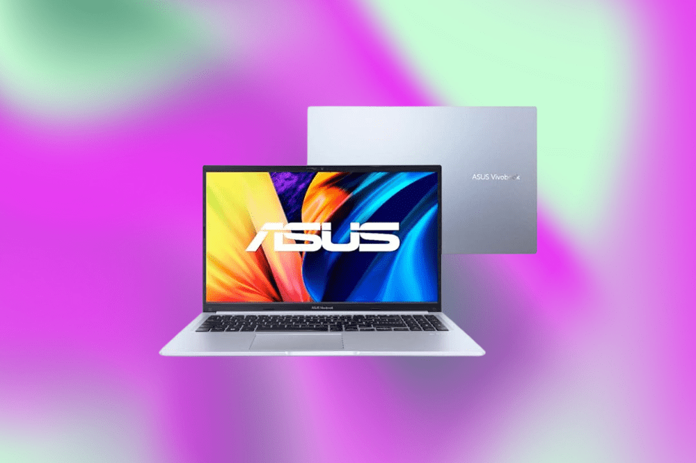Imagem de um laptop cinza claro em um fundo roxo e verde claro