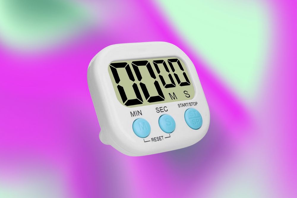 Imagem de um temporizador branco em um fundo roxo e verde.